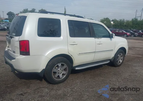 2011 Honda Pilot Touring z USA, uszkodzony, nr VIN 5FNYF4H92BB017270